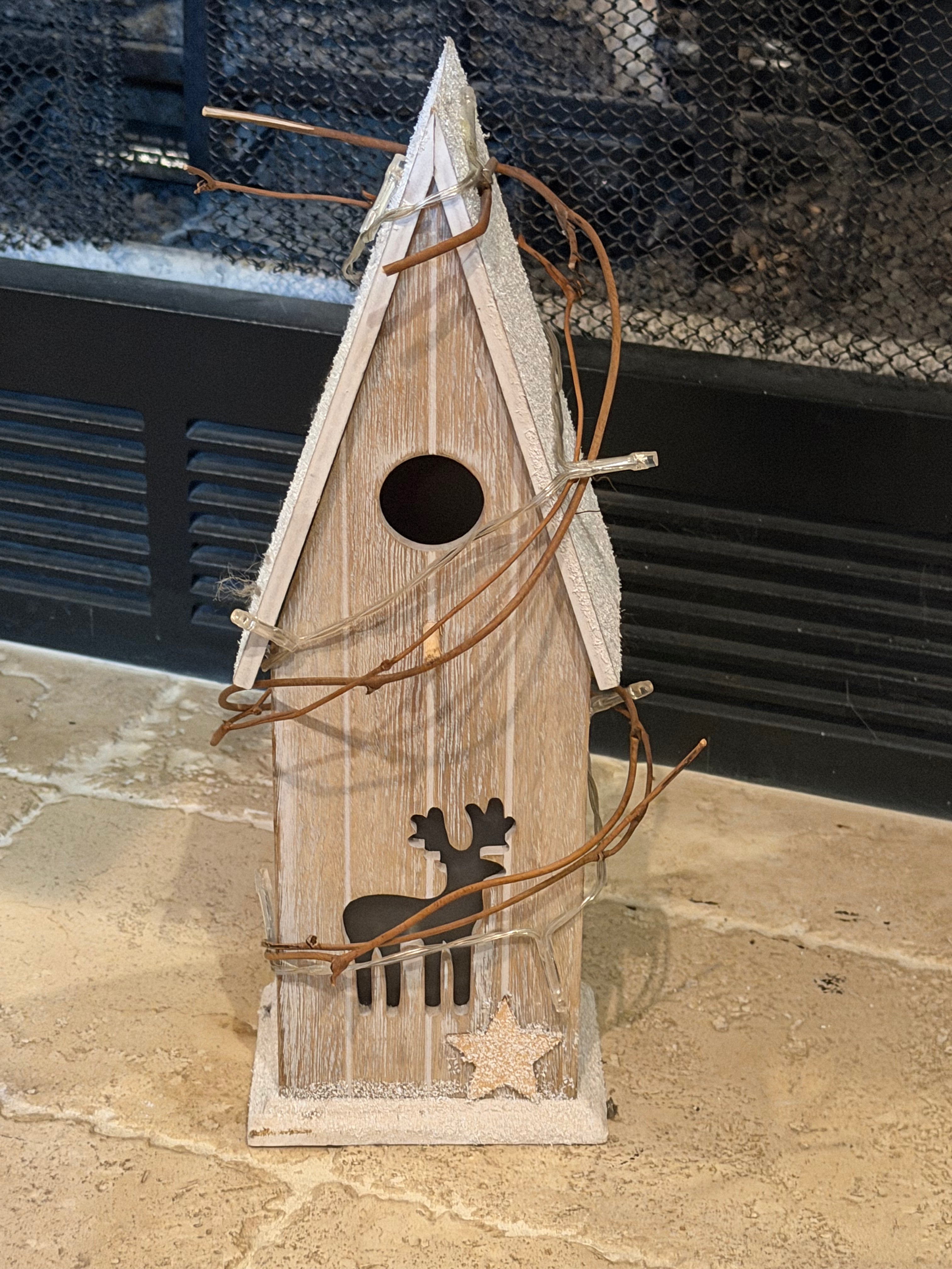 Twinkling house with deer